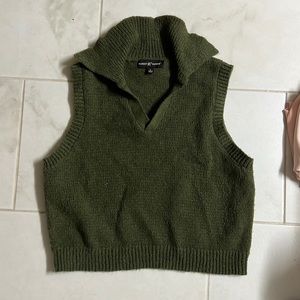 green sweater vest